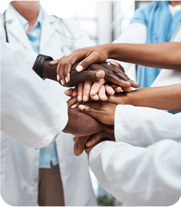 A team of doctors holding each other hand